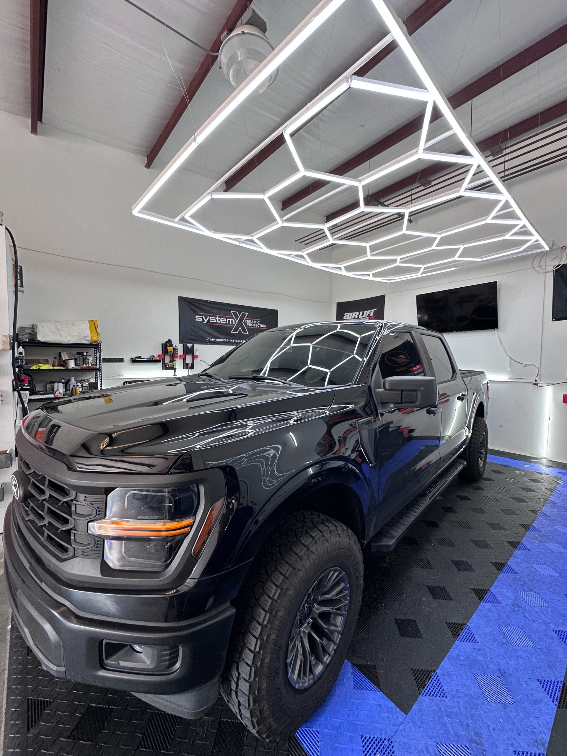 expert auto window tinting in Gainesville, GA on a grey ford truck.